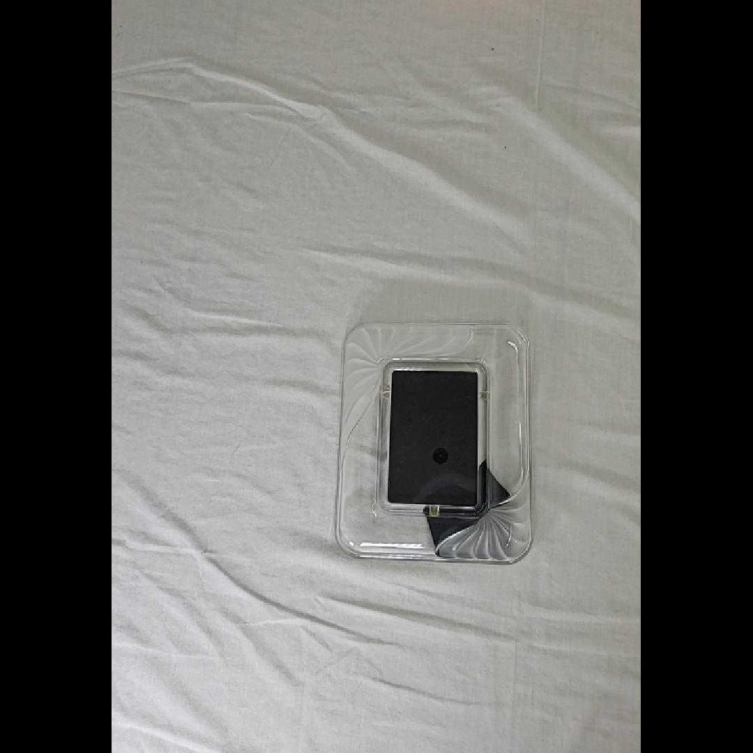 Sleek Black Device on Clear Tray